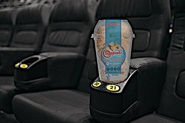 Carton of mini ring doughnuts and a row of cinema seats
