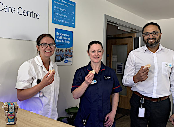 Sue Ryder staff enjoying their doughnuts in National Doughnut Week 2023