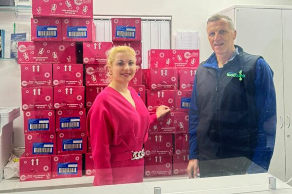 Operations manager Evita Dambrauska helping with the donation of 320 cartons of doughnuts for Blackburn Foodbank