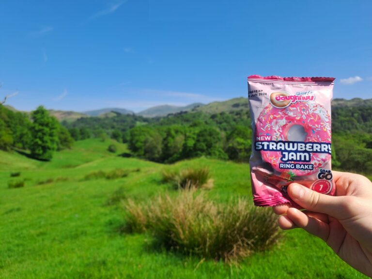 A walker showing off a Ring Bake doughnut during a walk in the Lake District. (Photo courtesy of Nathan Gregson.)