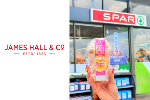 Hand holding an 8-pack of Classic Mini Ring Doughnuts in front of a SPAR store-front